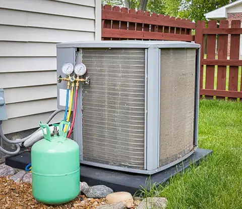 A customer's AC unit being recharged with refrigerant.